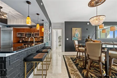 a very nice looking dining room with a table and chairs