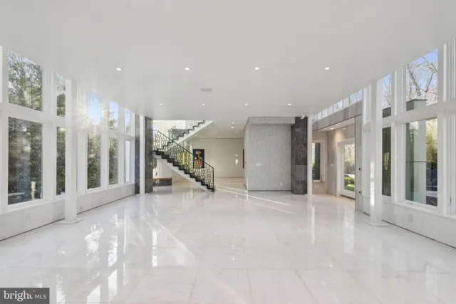 a view of a building with floor to ceiling windows and a room