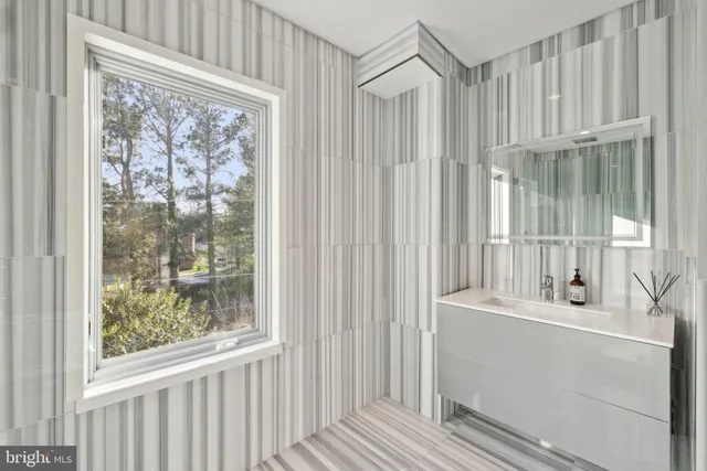 a view of an entryway with a floor to ceiling window