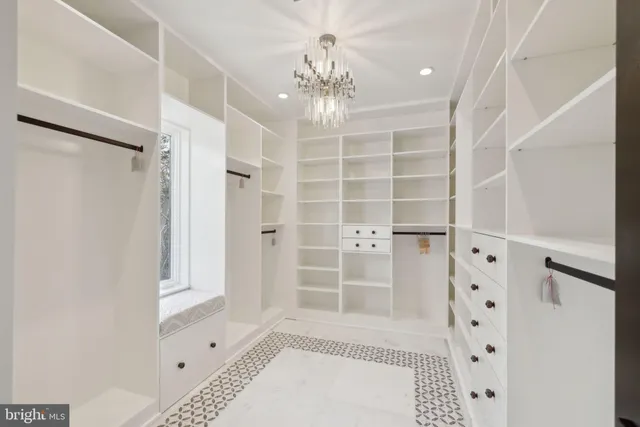 a spacious bathroom with a bathtub and a sink