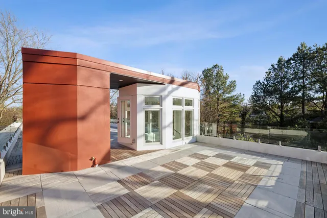 a view of a patio with table and chairs and potted plants