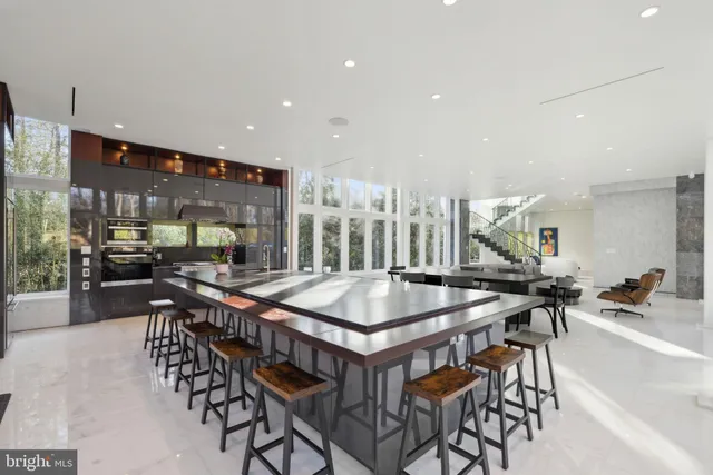 a kitchen with a table and chairs