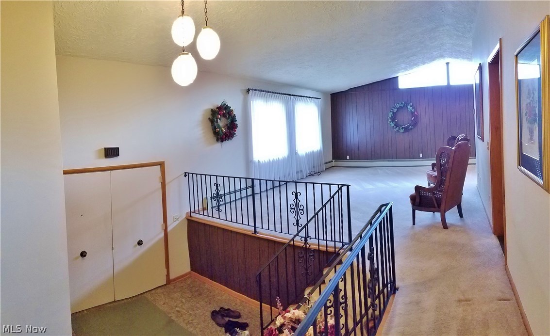 2888 Pressler Road Uniontown, OH 44685 - Photo 25 of 26 Double doors at entry hall on first level. Notice open floor plan and cathedral ceiling.