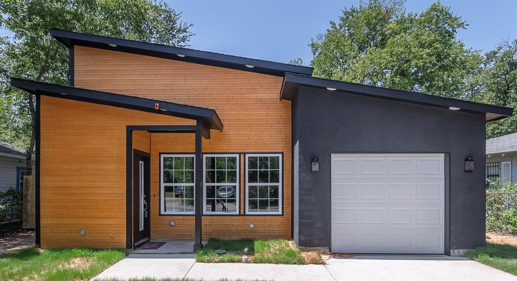 3220 Reed Lane Dallas, TX 75215 - Photo 1 of 1 a front view of a house with a garden