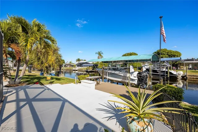 a view of a swimming pool with a table and chairs