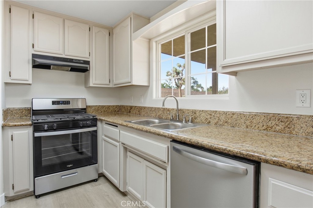 17964 Hackberry Street Hesperia, CA 92345 - Photo 17 of 32 a kitchen with stainless steel appliances granite countertop a stove and a sink
