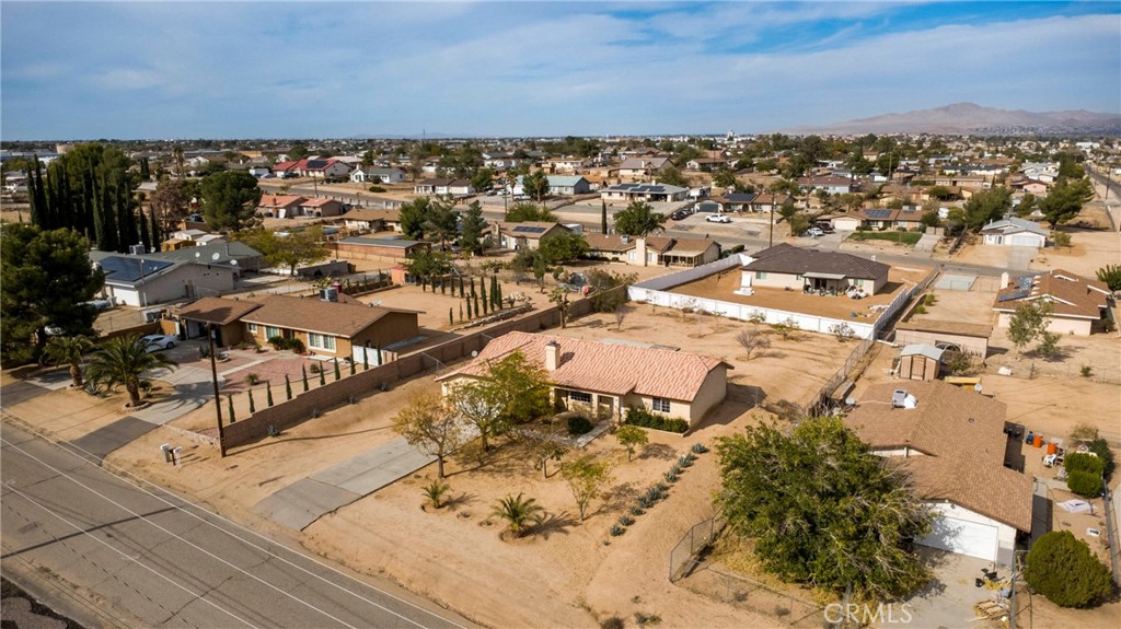 17964 Hackberry Street Hesperia, CA 92345 - Photo 27 of 32 an aerial view of residential building and parking space