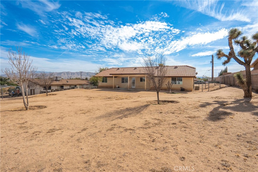 17964 Hackberry Street Hesperia, CA 92345 - Photo 30 of 32 a view of a yard with snow