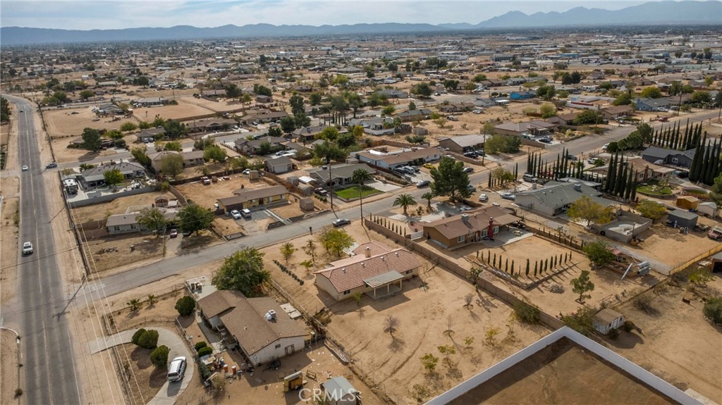 17964 Hackberry Street Hesperia, CA 92345 - Photo 31 of 32 an aerial view of residential houses with outdoor space