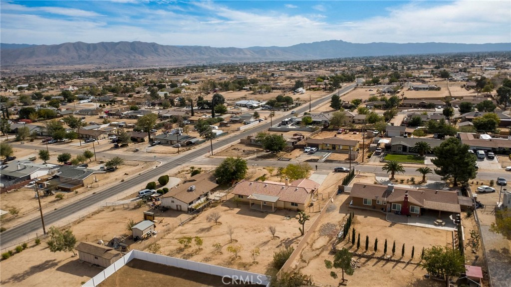 17964 Hackberry Street Hesperia, CA 92345 - Photo 32 of 32 an aerial view of residential houses with outdoor space