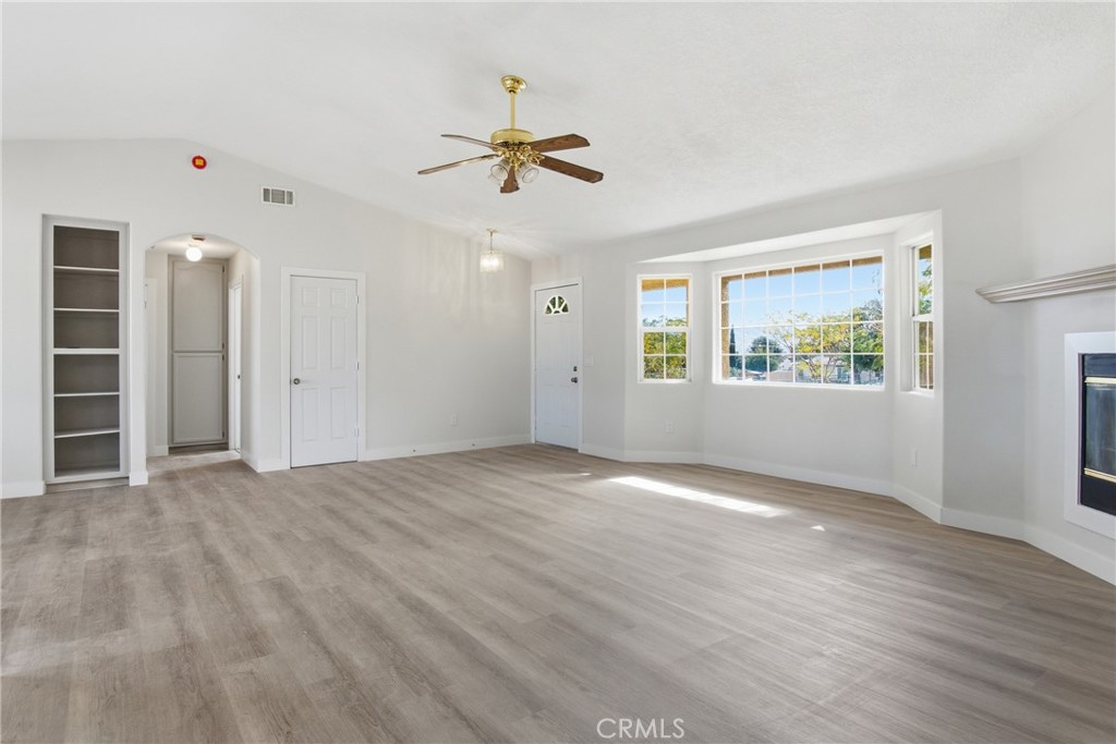 17964 Hackberry Street Hesperia, CA 92345 - Photo 7 of 32 a view of empty room with wooden floor and window