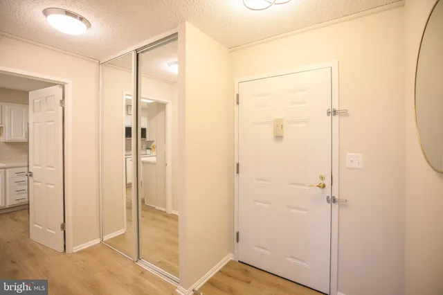 a bathroom with a shower and a glass door