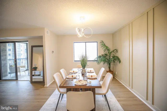 a view of a dining room with furniture window and wooden floor