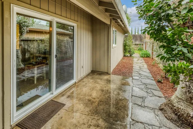 a kitchen with stainless steel appliances granite countertop a refrigerator stove a sink and microwave