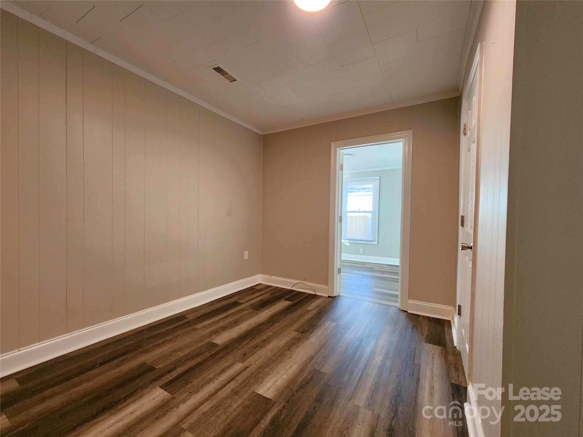 2802 Maryland Avenue Kannapolis, NC 28083 - Photo 12 of 19 a view of a room with wooden floor and a window
