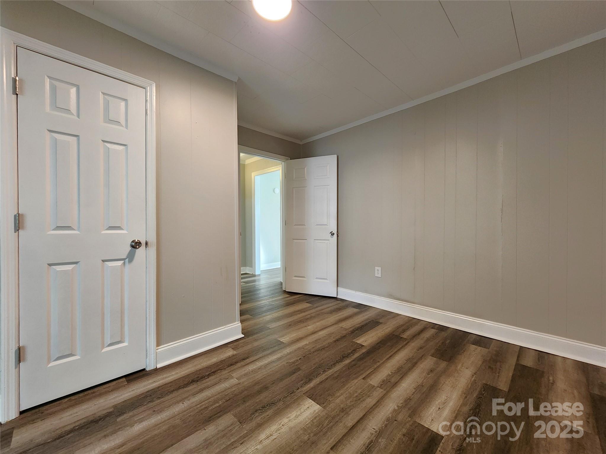 2802 Maryland Avenue Kannapolis, NC 28083 - Photo 13 of 19 a view of an empty room and wooden floor