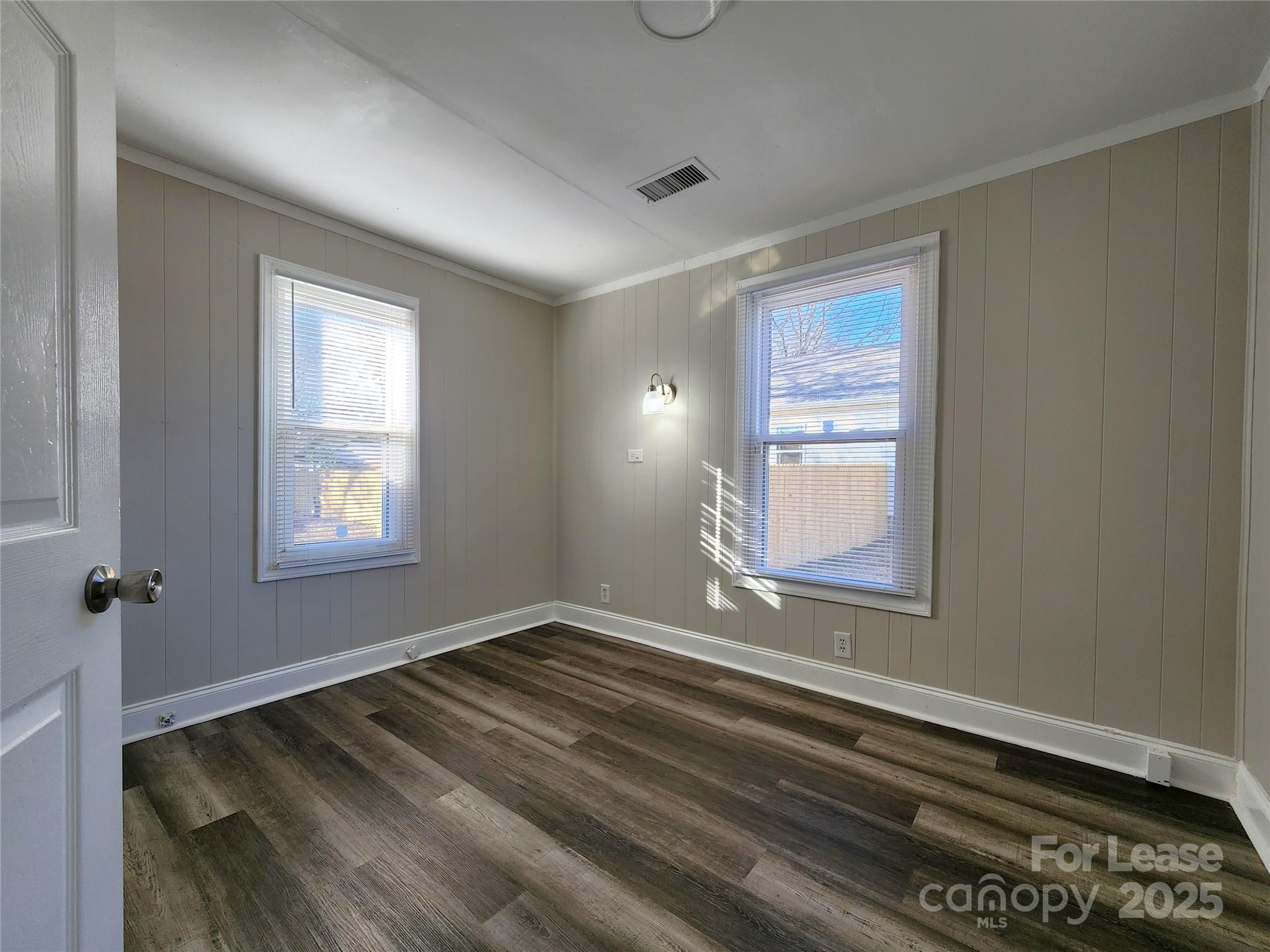 2802 Maryland Avenue Kannapolis, NC 28083 - Photo 14 of 19 a view of a room that has a window and wooden floor