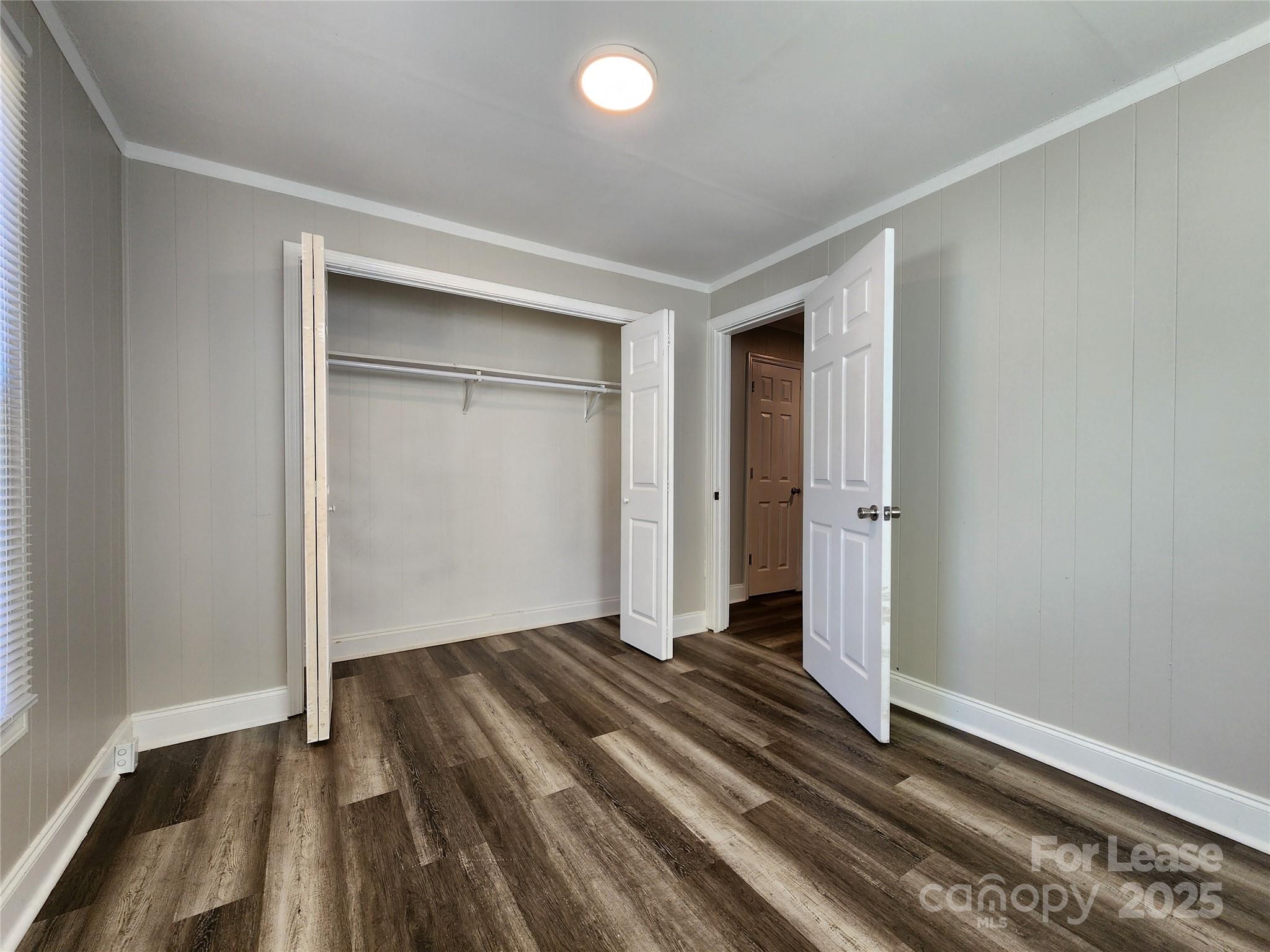 2802 Maryland Avenue Kannapolis, NC 28083 - Photo 15 of 19 an empty room with wooden floor and closet