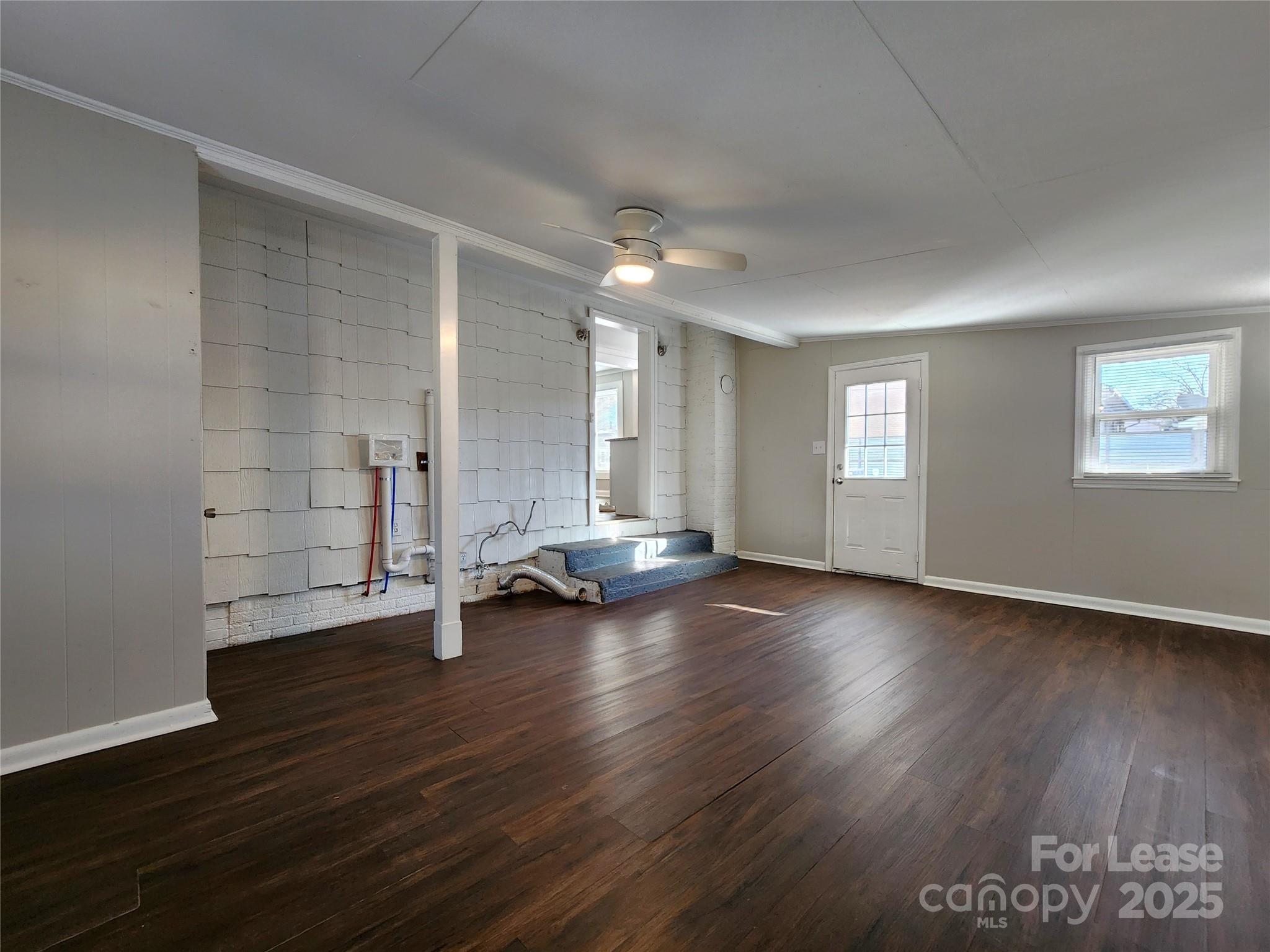 2802 Maryland Avenue Kannapolis, NC 28083 - Photo 16 of 19 an empty room with wooden floor and windows