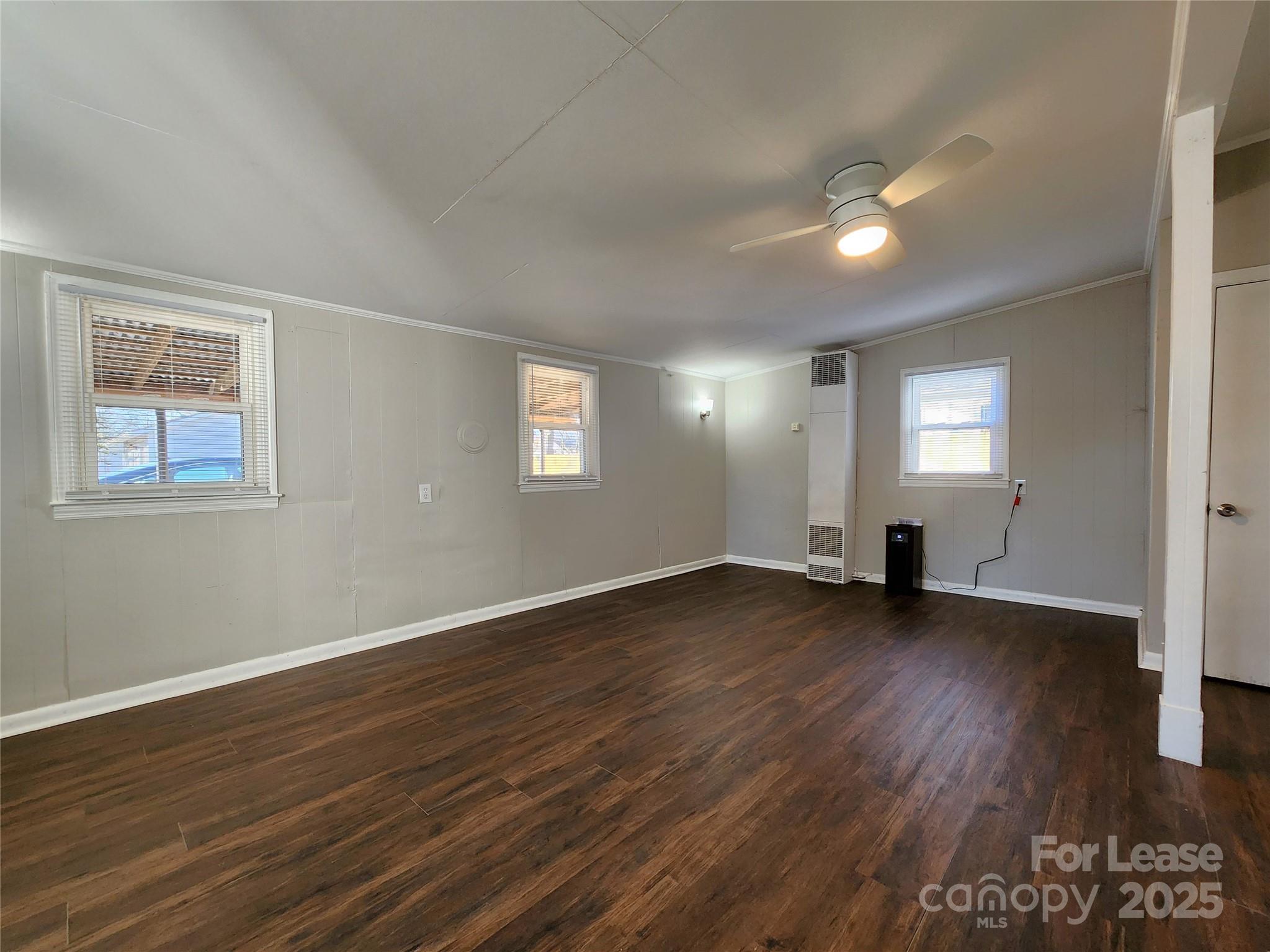 2802 Maryland Avenue Kannapolis, NC 28083 - Photo 17 of 19 a view of empty room with wooden floor and fan