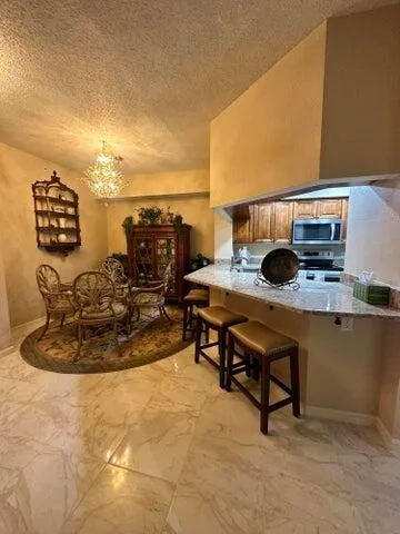 a living room with a flat screen tv and outdoor seating