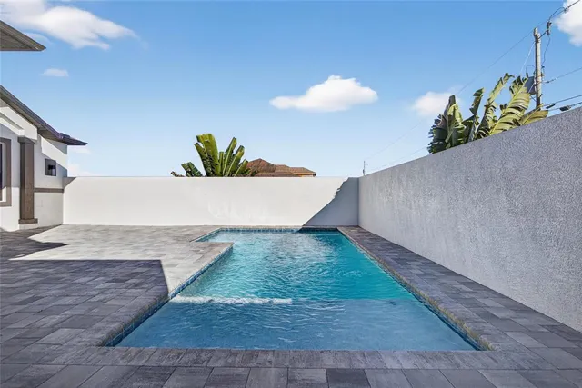 an aerial view of residential building and ocean