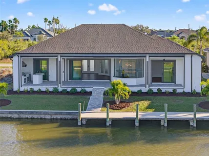 a view of a house with pool yard and a yard