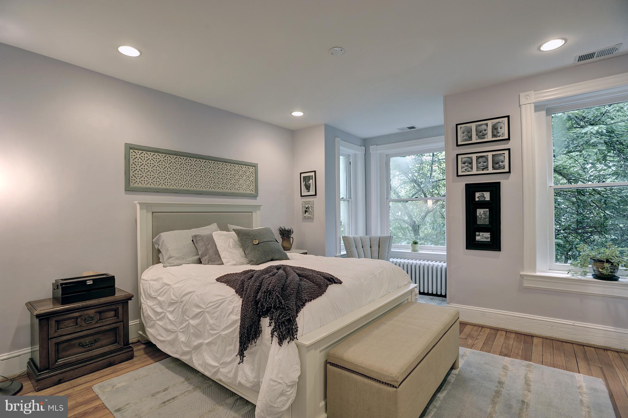 919 E Street Southeast Washington, DC 20003 - Photo 8 of 18 Master bed flooded w/natural light thru bay front