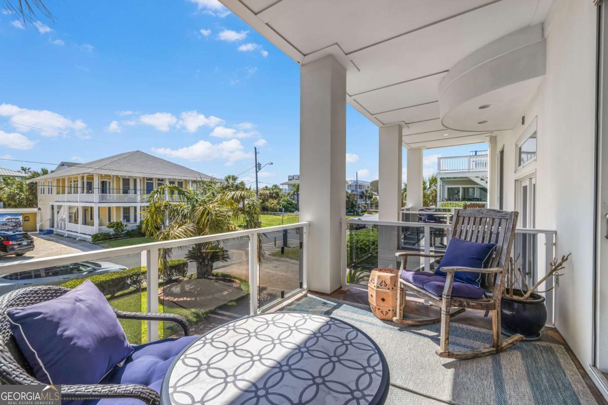 8 18th Street Tybee Island, GA 31328 - Photo 8 of 50 a view of a balcony with chairs