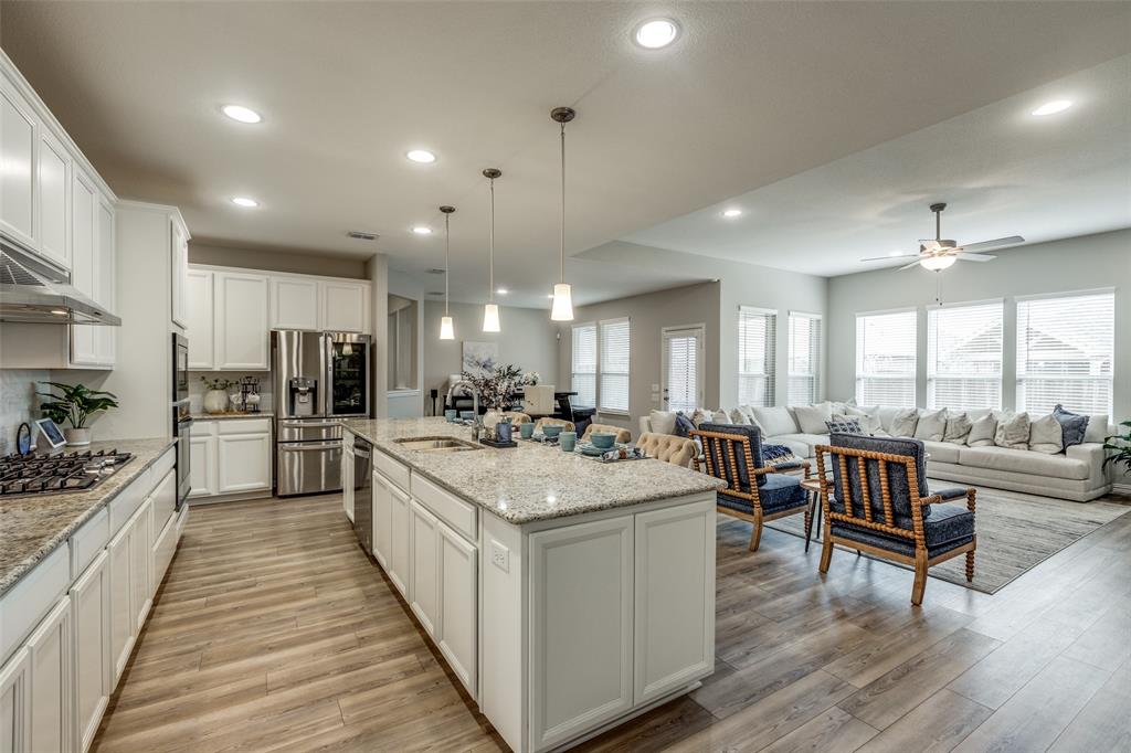 Welcome home to this beautiful open kitchen and living room with a fireplace 