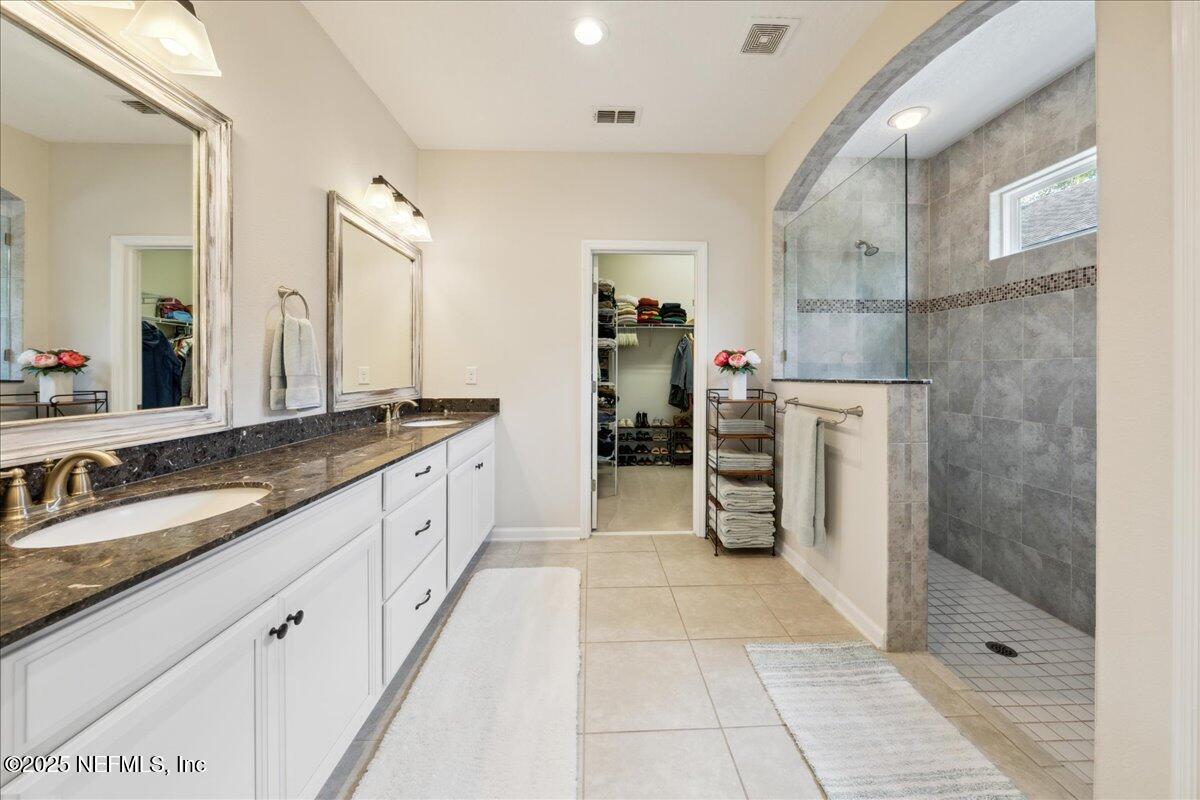 31 Skylar Lane Ponte Vedra, FL 32081 - Photo 14 of 32 a large white bathroom with a granite countertop sink mirror and shower