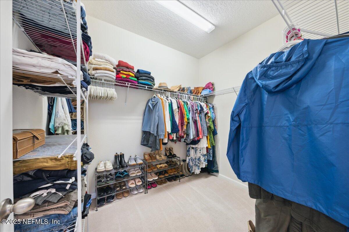 31 Skylar Lane Ponte Vedra, FL 32081 - Photo 18 of 32 a view of walk in closet with clothes