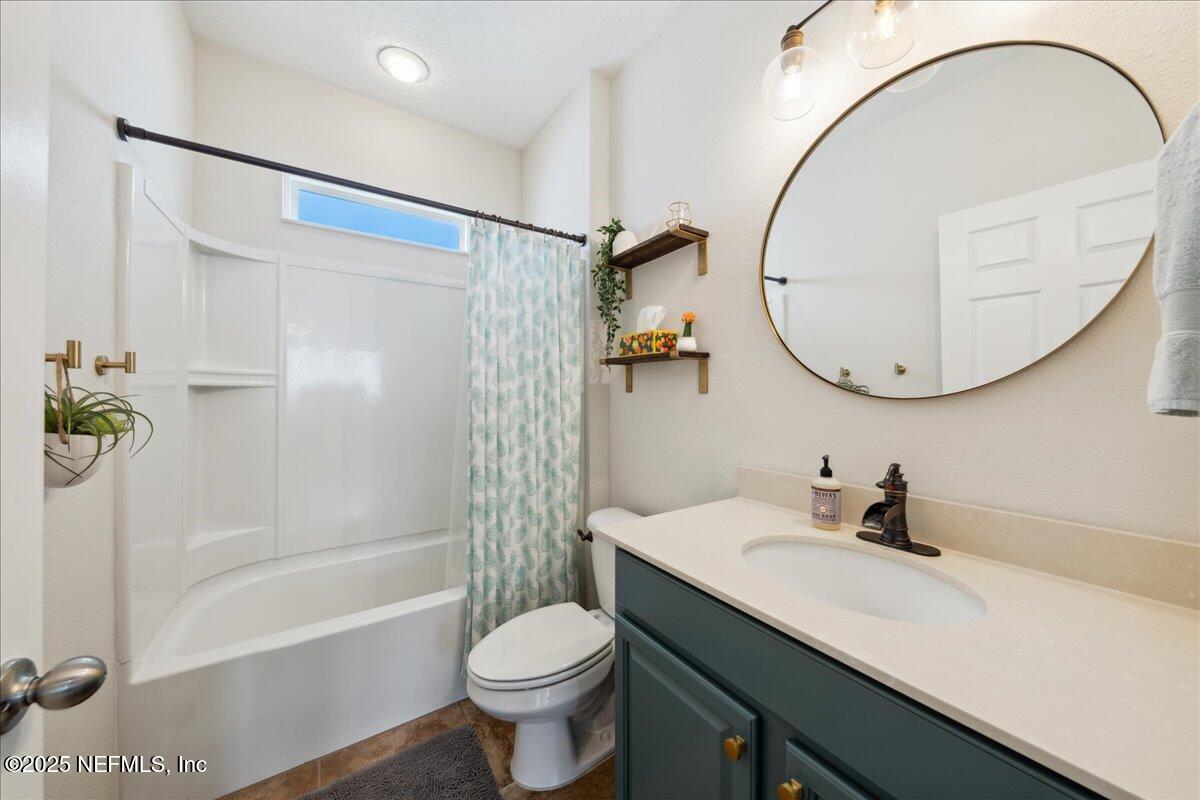 31 Skylar Lane Ponte Vedra, FL 32081 - Photo 21 of 32 a bathroom with a sink a toilet and a mirror