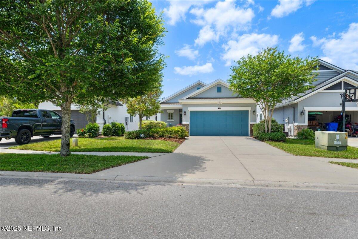 31 Skylar Lane Ponte Vedra, FL 32081 - Photo 27 of 32 a front view of a house with a yard and a garage