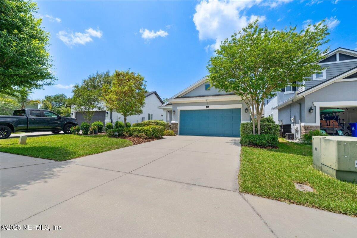 31 Skylar Lane Ponte Vedra, FL 32081 - Photo 28 of 32 a front view of a house with a yard and a garage