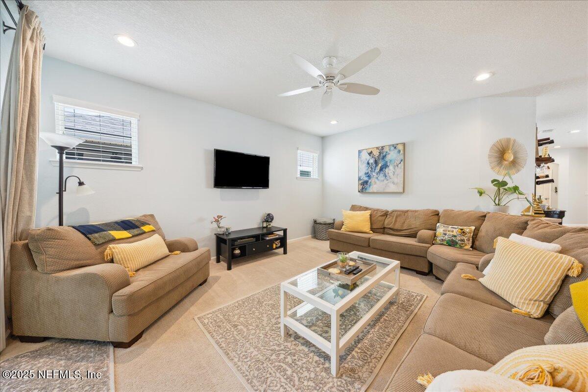 31 Skylar Lane Ponte Vedra, FL 32081 - Photo 3 of 32 a living room with furniture and a flat screen tv