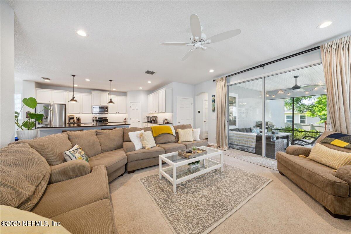 31 Skylar Lane Ponte Vedra, FL 32081 - Photo 6 of 32 a living room with furniture kitchen view and a large window