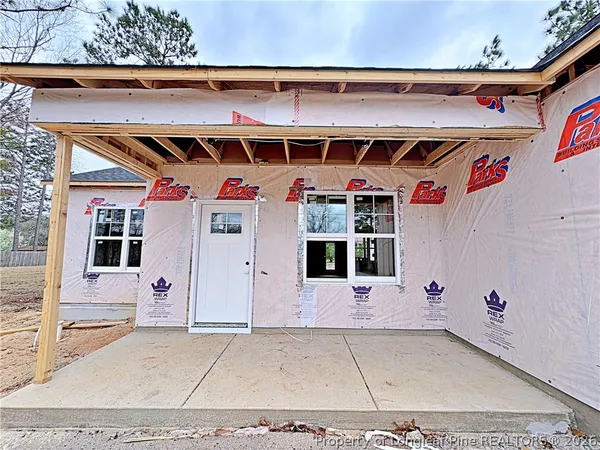 a front view of a building with white walls