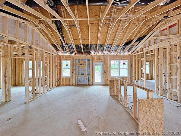 a view of an empty room with windows