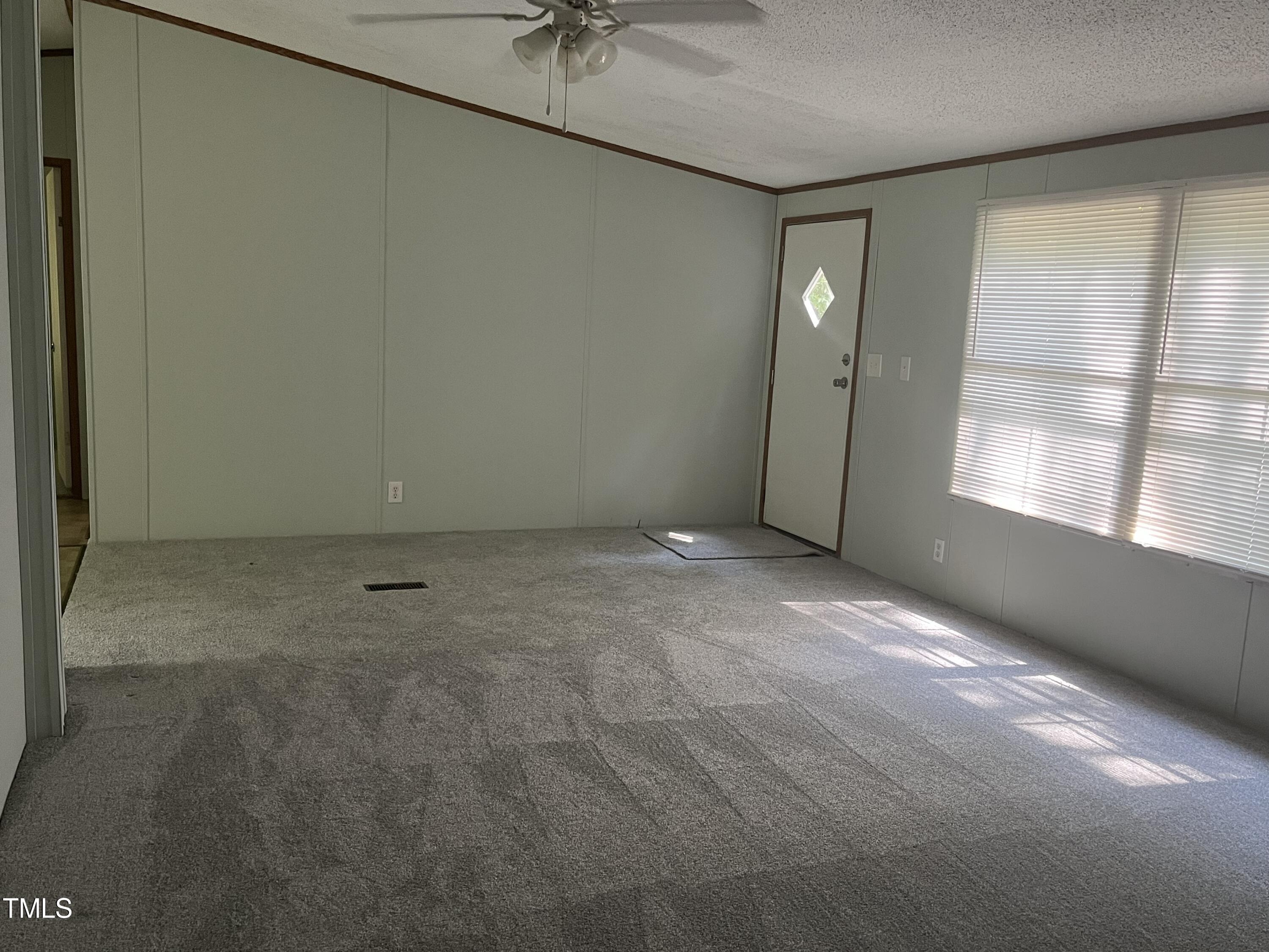 118 Portia Lane Roxboro, NC 27574 - Photo 2 of 16 an empty room with a empty space and a window