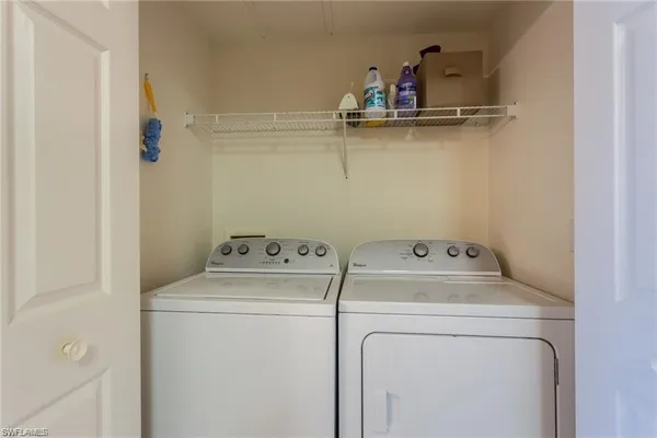 a view of storage and utility room with washer and dryer