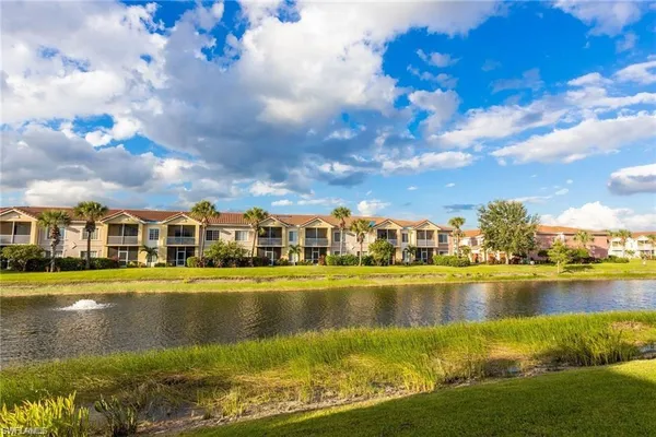 a view of a lake with houses in the backyard