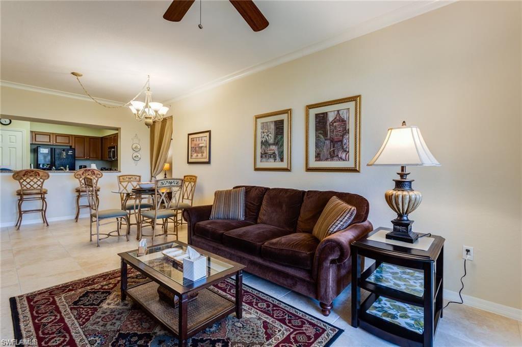 20201 Estero Gardens Circle, Unit 104 Estero, FL 33928 - Photo 8 of 38 a living room with furniture and wooden floor
