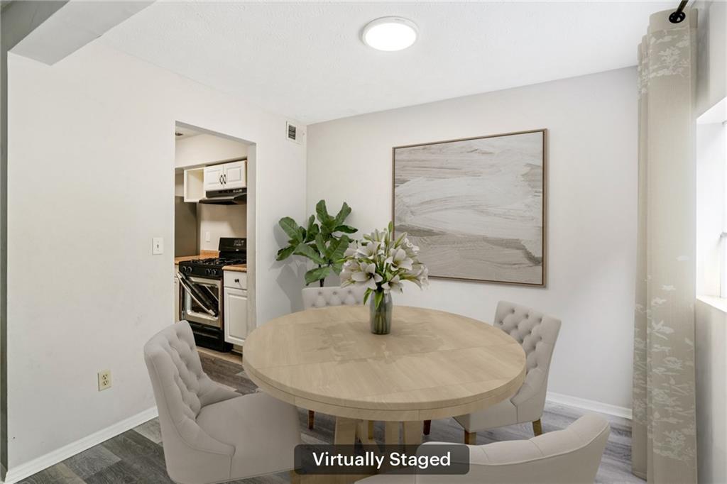1608 Pine Tree Trail Atlanta, GA 30349 - Photo 5 of 17 a dining room with furniture and wooden floor