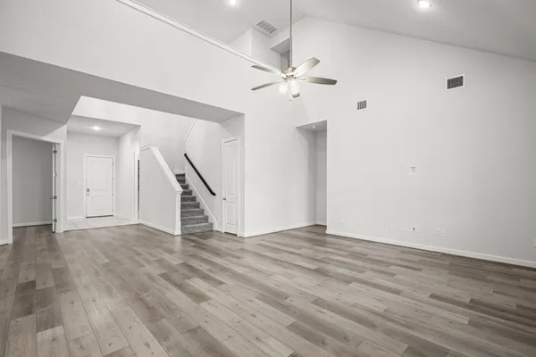 a kitchen with stainless steel appliances granite countertop a refrigerator stove microwave and sink