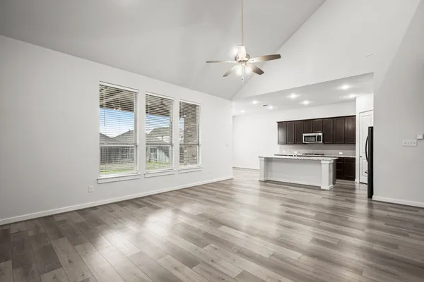 a kitchen with a sink stove and microwave