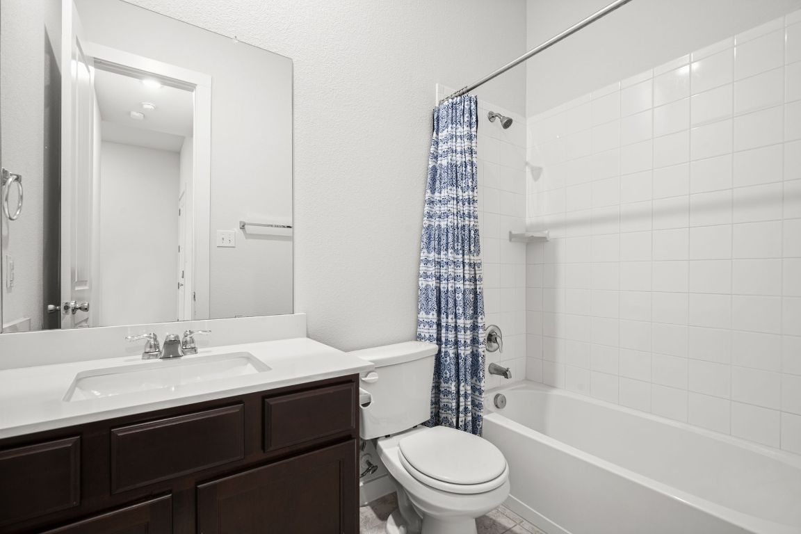 841 Spinnaker Loop Kyle, TX 78640 - Photo 19 of 40 a bathroom with a sink a toilet and shower