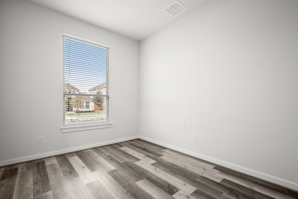 841 Spinnaker Loop Kyle, TX 78640 - Photo 20 of 40 an empty room with a window