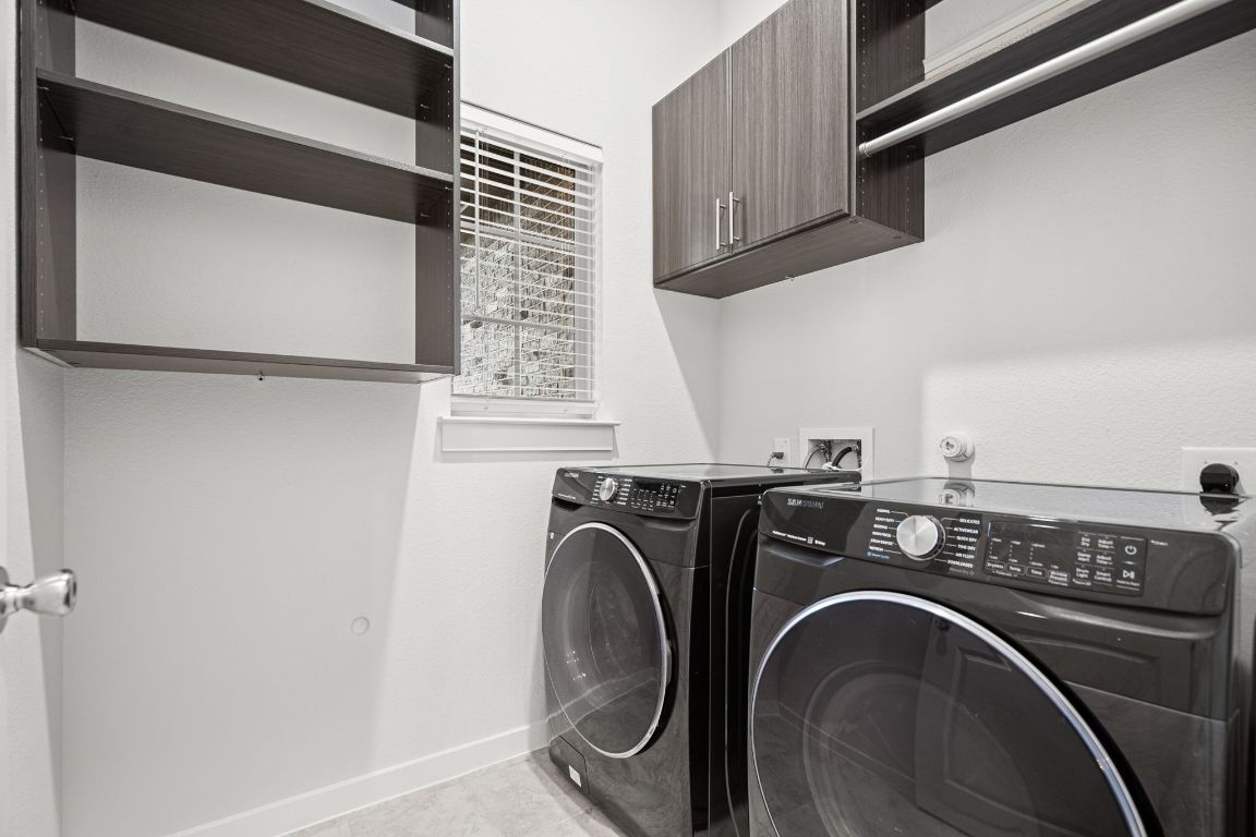 841 Spinnaker Loop Kyle, TX 78640 - Photo 21 of 40 a utility room with dryer and washer