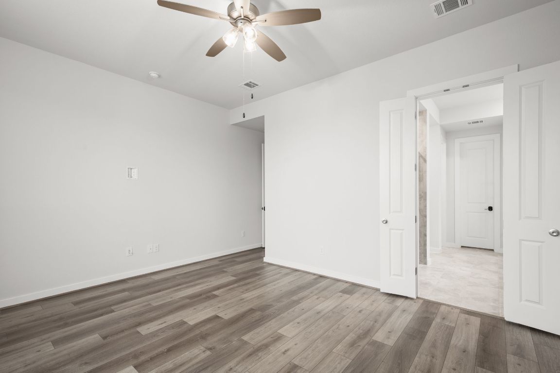 841 Spinnaker Loop Kyle, TX 78640 - Photo 23 of 40 wooden floor in an empty room